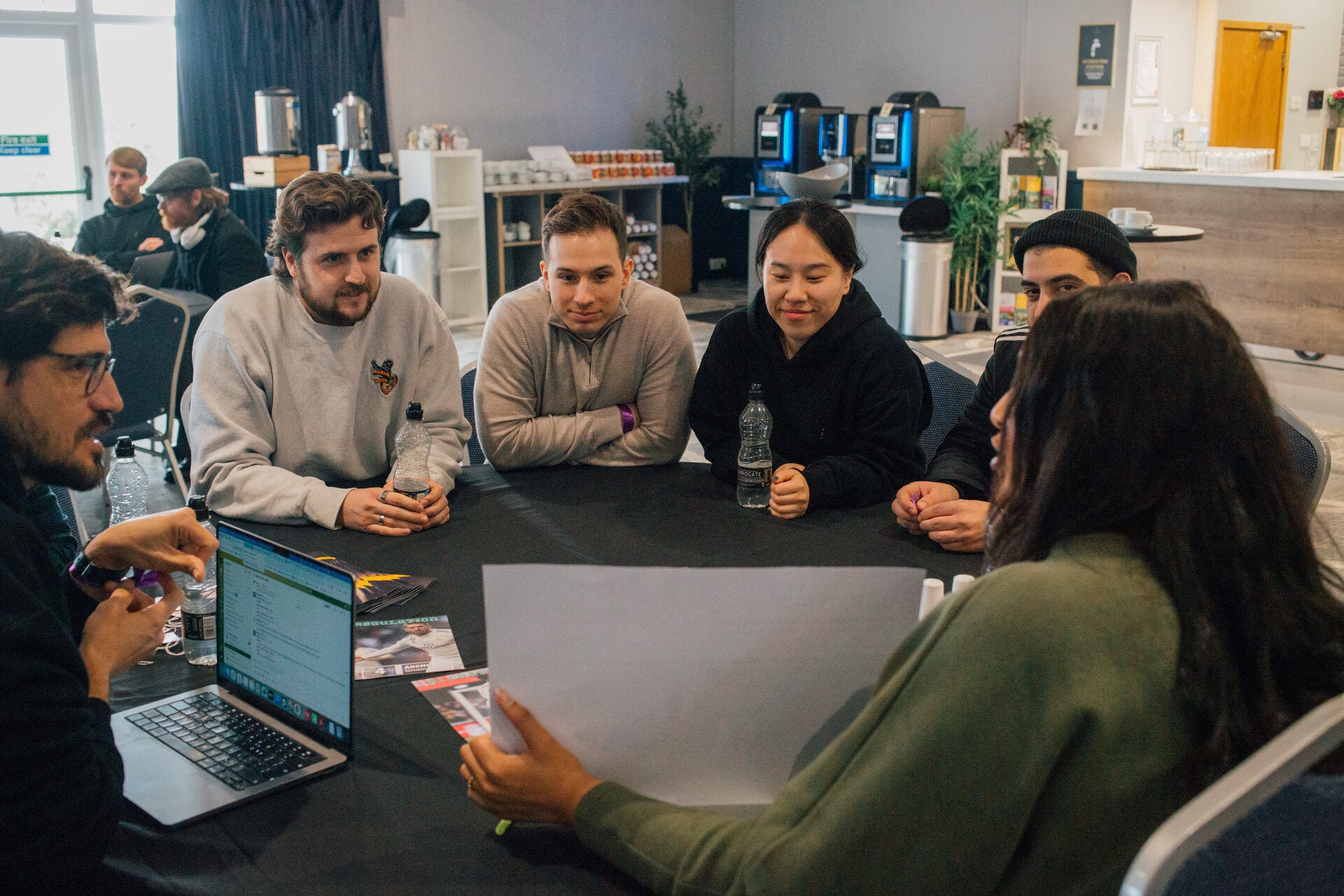 Engineering team collaborating around a table